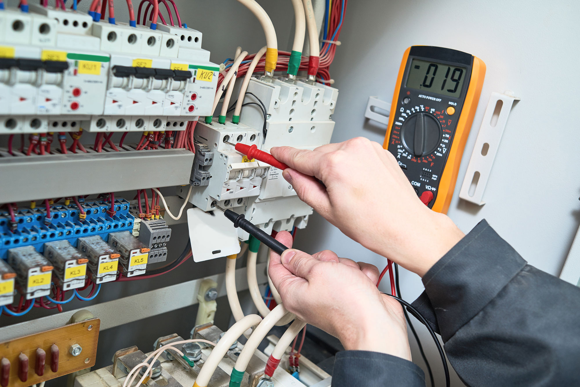 Electrician working on cables